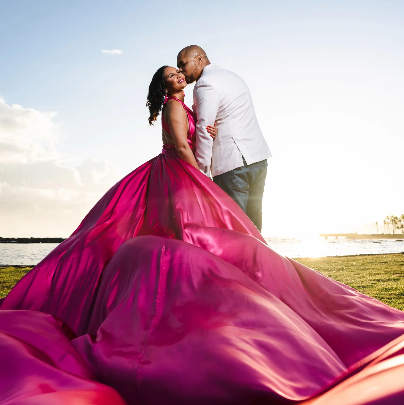Kris and Catrena embracing at sunset by the Puerto Rico coast
